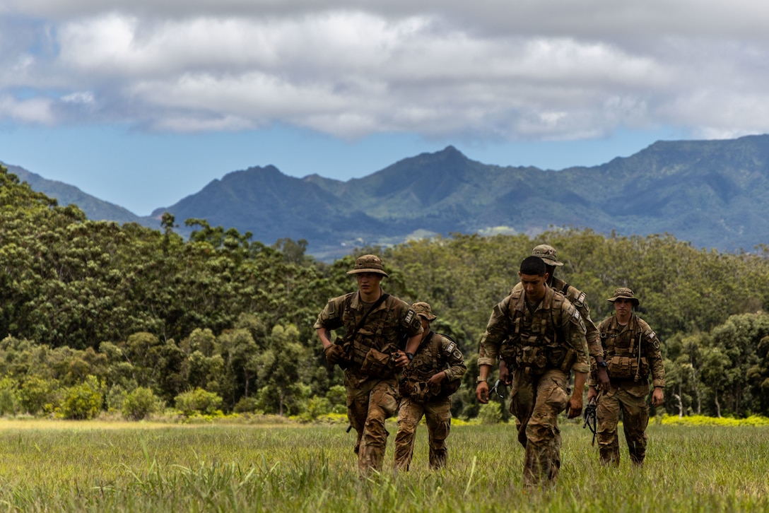 U.S. Army Soldiers assigned to 8th Theater Sustainment Command conduct land navigation during the U.S. Army Pacific Best Squad Competition, July 16, 2025.