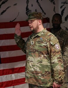 U.S. Army Sgt. 1st Class Adam Proctor recites the oath of enlistment at his re-enlistment ceremony during the 2025 Department of Defense Warrior Games at Colorado Springs, Colorado, July 18, 2025.