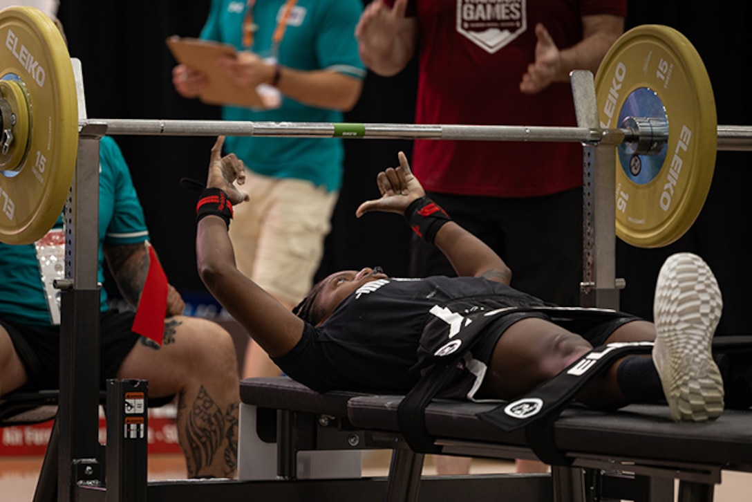 U.S. Army 1st Lt. Jani Merritt celebrates after completing her rep at the powerlifting competition during the 2025 Department of Defense Warrior Games at Colorado Springs, Colorado, July 18, 2025.
