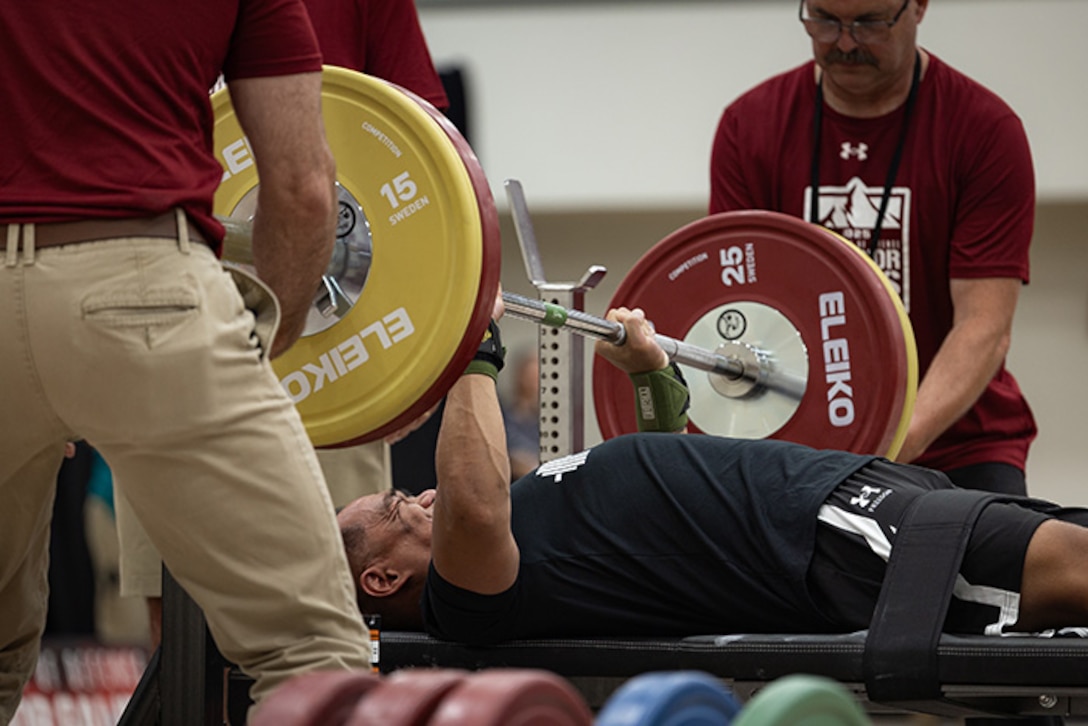 U.S. Army Staff Sgt. Nathaniel Mateo pushes hard to finish his rep while participating in the powerlifting competition during the 2025 Department of Defense Warrior Games at Colorado Springs, Colorado, July 18, 2025.