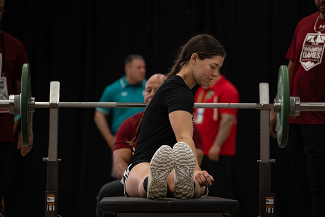 U.S. Army Sgt. Bianca Hayden stretches before competing in the powerlifting competition during the 2025 Department of Defense Warrior Games at Colorado Springs, Colorado, July 18, 2025.