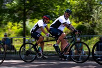 Tandem pilot U.S. Army Capt. Carlos Rivera, front, and tandem stoker U.S. Army Retired Sgt. 1st Class Henry Escobedo use joint efforts and push forward during the cycling event in the 2025 Department of Defense Warrior Games, Colorado Springs, Colorado, July 19, 2025.