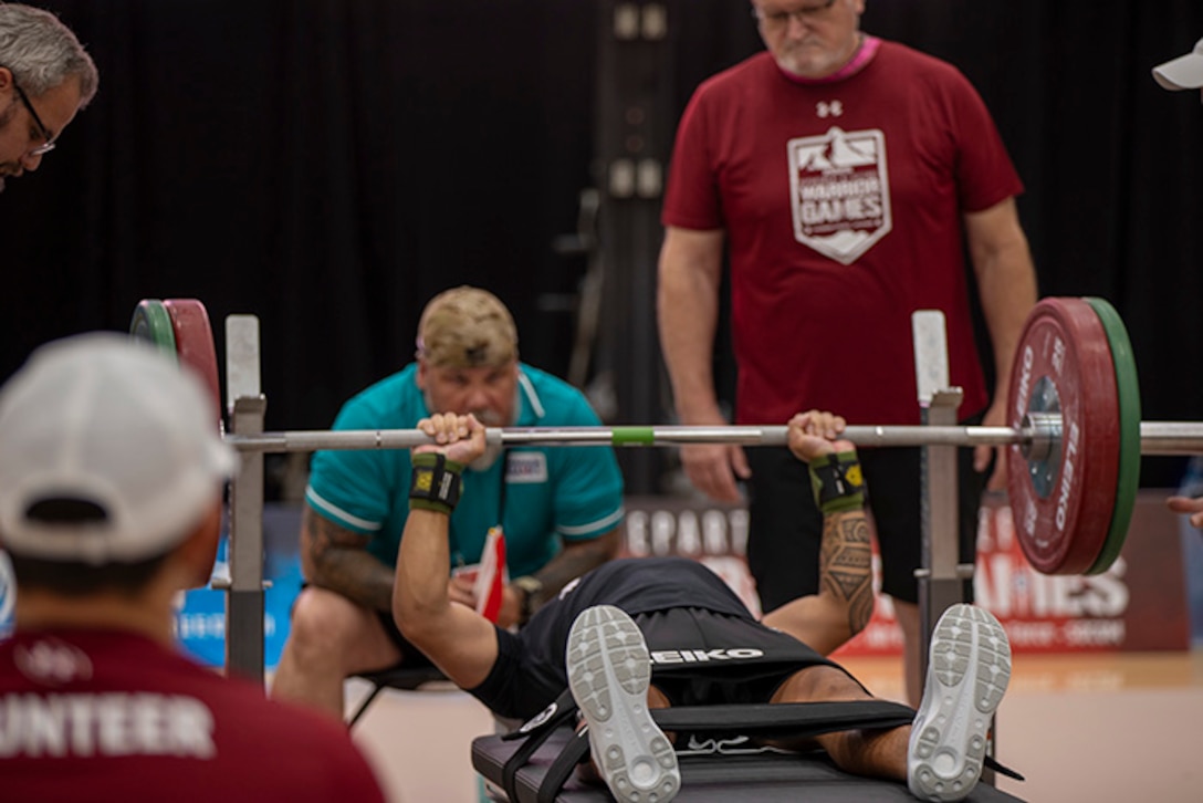 U.S. Army Staff Sgt. Nathaniel “Nate” Mateo pushes up his first rep during the powerlifting event at the 2025 Department of Defense Warrior Games at Reid Arena, Colorado Springs, Colorado, July 18, 2025.