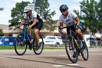 .S. Army Lt. Col. Sherri Sanders, left, and Staff Sgt. Mercedes Rangel, right, compete in the cycling event during the 2025 Department of Defense Warrior Games at Colorado Springs, Colorado, July 19, 2025.