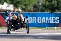 U.S. Army Maj. Amanda Feindt turns a corner in the cycling event during the 2025 Department of Defense Warrior Games at Colorado Springs, Colorado, July 19, 2025.