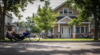 Department of Defense Warrior Games athletes speed through a quiet neighborhood on their recumbent cycles during cycling event in the 2025 Department of Defense Warrior Games, Colorado Springs, Colorado, July 19, 2025.