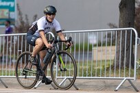 U.S. Army Capt. Kyra Maggio prepares to take a corner in the cycling event during the 2025 Department of Defense Warrior Games at Colorado Springs, Colorado, July 19, 2025.