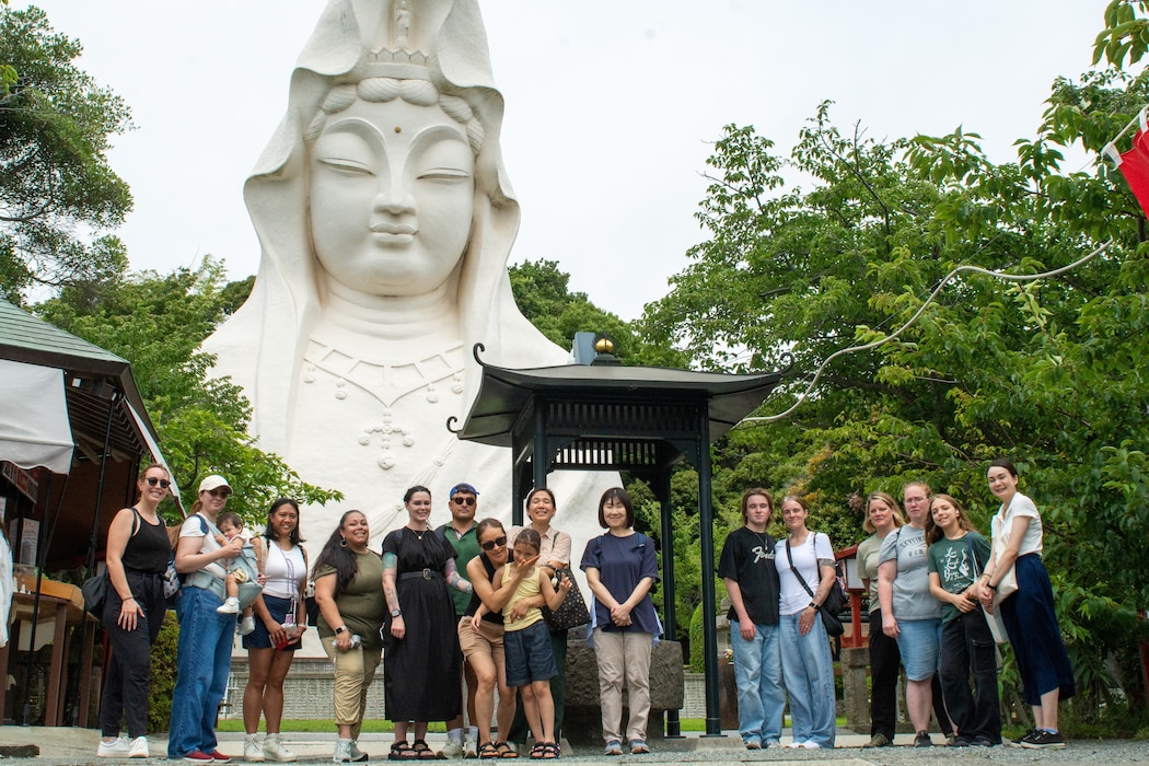 The team from Commander, Fleet Activities Yokosuka (CFAY) Fleet and Family Support Center (FFSC) guides participants on a tour of the Buddhist Temple, Ofuna-Kannon-Ji.
