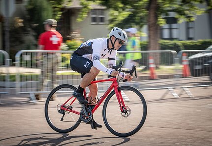 U.S. Army Staff Sgt. Tam Hoang pushes through the initial stretch of the cycling competition in the 2025 Department of Defense Warrior Games, Colorado Springs, Colorado, July 19, 2025.