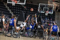Team Army attempts to block a Team Air Force shot during wheelchair basketball at the 2025 Department of Defense Warrior Games in Colorado Springs, Colorado July 19, 2025.
