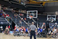 Team Army and Team Air Force fight for a loose ball during a game of wheelchair basketball at the 2025 Department of Defense Warrior Games in Colorado Springs, Colorado July 19, 2025.