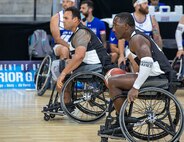 U.S. Army Master Sgt. Earlie Brown and Sgt. Jimmy Canderlario race up the court during a wheelchair basketball game at the 2025 Department of Defense Warrior Games at Ed Robson Arena in Colorado Springs, Colorado, July 19, 2025.