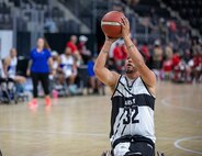 U.S. Army Retired Staff Sgt. Michael Britton drives toward the basket to take a shot during a wheelchair basketball game at the 2025 Department of Defense Warrior Games at Ed Robson Arena in Colorado Springs, Colorado, July 19, 2025.