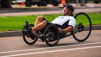 U.S. Army 1st Sgt. Christopher Morago competes in the cycling event on a recumbent cycle during the 2025 Department of Defense Warrior Games at Colorado Springs, Colorado, July 19, 2025.