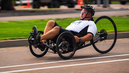 U.S. Army 1st Sgt. Christopher Morago competes in the cycling event on a recumbent cycle during the 2025 Department of Defense Warrior Games at Colorado Springs, Colorado, July 19, 2025.
