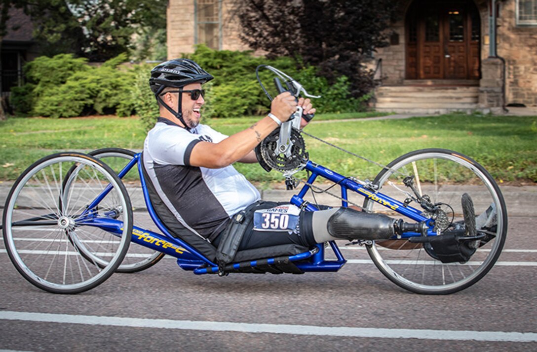 U.S. Army Retired Spc. Anthony Farve, charges forward during the cycling competition on a handcycle during the 2025 Department of Defense Warrior Games, Colorado Springs, Colorado, July 19, 2025.