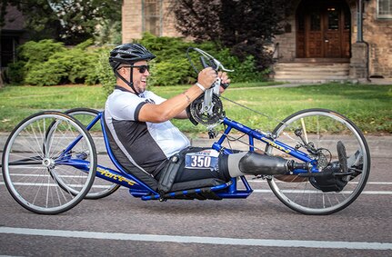 U.S. Army Retired Spc. Anthony Farve, charges forward during the cycling competition on a handcycle during the 2025 Department of Defense Warrior Games, Colorado Springs, Colorado, July 19, 2025.