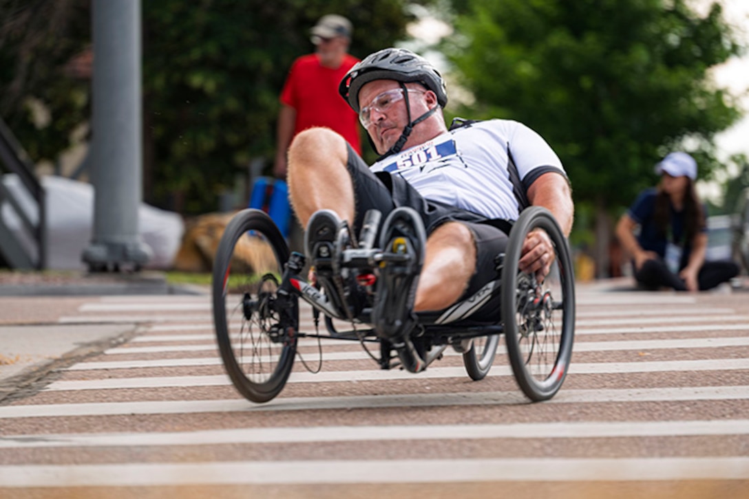 U.S. Army 1st Sgt. Christopher Morago takes a corner on a recumbent cycle during the cycling event at the 2025 Department of Defense Warrior Games at Colorado Springs, Colorado, July 19, 2025.