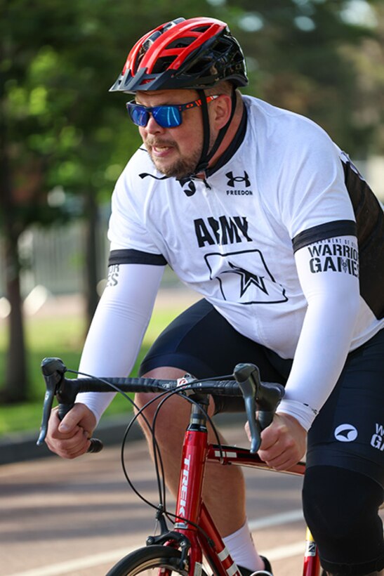 U.S. Army Sgt. 1st Class Adam Proctor competes in the times trials at the cycling event during the 2025 Department of Defense Warrior Games at Colorado Springs, Colorado, July 19, 2025.