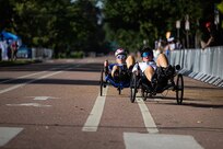 U.S. Army Maj. Amanda Feindt, right, pushes for the lead against a Team Air Force athlete in the women's recumbent cycle road race at the cycling event during the 2025 Department of Defense Warrior Games at Colorado College, Colorado Springs Colorado, July 19, 2025.