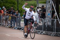 U.S. Army Sgt. 1st Class Adam Proctor celebrates after crossing the finish line during the men's upright bicycle road race at the cycling event during the 2025 Department of Defense Warrior Games at Colorado College, Colorado Springs Colorado, July 19, 2025.