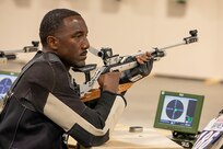 U.S. Army Master Sgt. Earlie Brown prepares to fire an air rifle during shooting practice at the 2025 Department of Defense Warrior Games in Colorado Springs, Colorado, July 20, 2025.