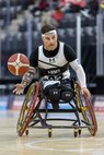 Retired U.S. Army Spc. JP Lane brings the ball up court in a wheelchair basketball game during the 2025 Department of Defense Warrior Games at Colorado Springs, Colorado, July 19, 2025.