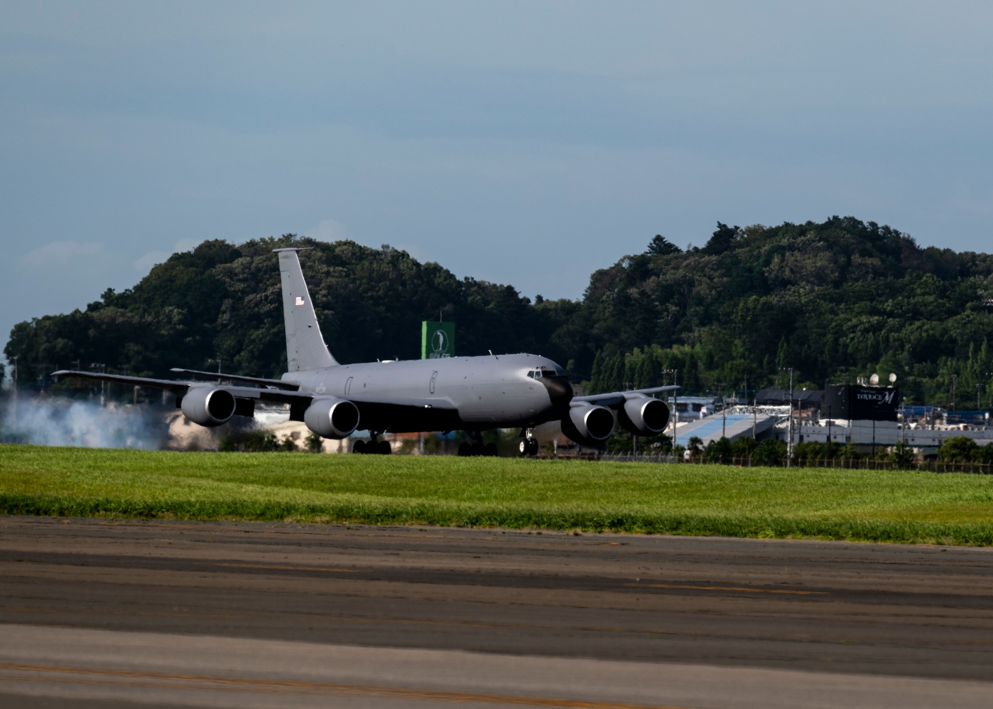 A KC-135 Stratotanker aircraft lands on the runway.