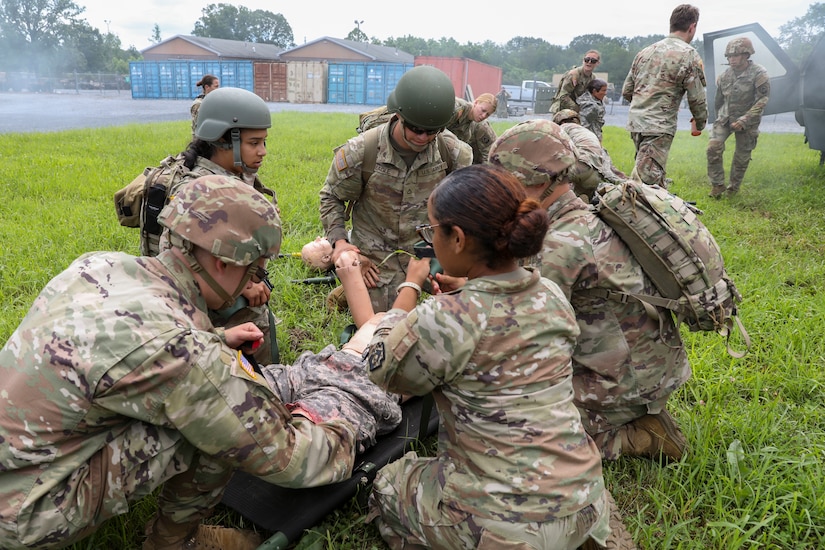 U.S. Soldiers with the 108th Medical Company Area Support, 213th Regional Support Group, Pennsylvania Army National Guard, pull simulated casualties from a simulated helicopter crash at Fort Indiantown Gap, Pennsylvania, July 18, 2025.