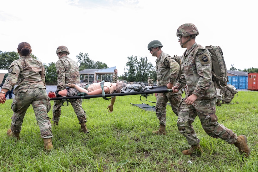 U.S. Soldiers with the 108th Medical Company Area Support, 213th Regional Support Group, Pennsylvania Army National Guard, pull simulated casualties from a simulated helicopter crash at Fort Indiantown Gap, Pennsylvania, July 18, 2025.
