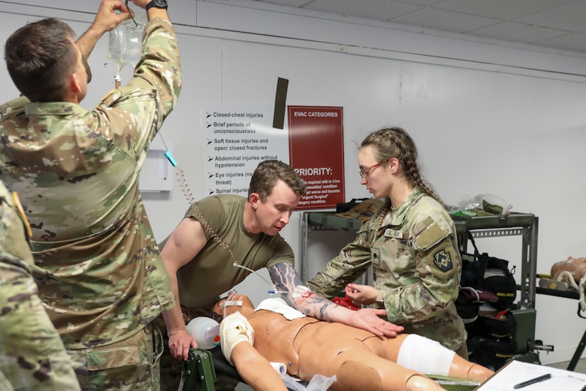 U.S. Soldiers with the 108th Medical Company Area Support, 213th Regional Support Group, Pennsylvania Army National Guard, pull simulated casualties from a simulated helicopter crash at Fort Indiantown Gap, Pennsylvania, July 18, 2025.