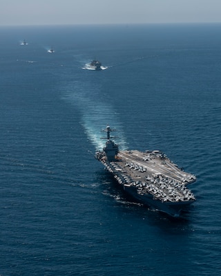 The world's largest aircraft carrier, USS Gerald R. Ford (CVN 78), Spanish Navy Santa Maria-class frigate ESPS Canarias (F86), fast combat support ship USNS Supply (T-AOE 6), and Arleigh Burke-class guided-missile destroyer USS Winston S. Churchill (DDG 81), transit the Strait of Gibraltar, July 17, 2025. Gerald R. Ford, a first-in-class aircraft carrier and deployed flagship of Carrier Strike Group Twelve, is on a scheduled deployment in the U.S. 6th Fleet area of operations to support the warfighting effectiveness, lethality, and readiness of U.S. Naval Forces Europe-Africa, and defend U.S., Allied and partner interests in the region. (U.S. Navy photo by Mass Communication Specialist 2nd Class Jacob Mattingly)