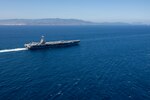 The world's largest aircraft carrier, USS Gerald R. Ford (CVN 78), transits the Strait of Gibraltar, July 17, 2025. Gerald R. Ford, a first-in-class aircraft carrier and deployed flagship of Carrier Strike Group Twelve, is on a scheduled deployment in the U.S. 6th Fleet area of operations to support the warfighting effectiveness, lethality, and readiness of U.S. Naval Forces Europe-Africa, and defend U.S., Allied and partner interests in the region. (U.S. Navy photo by Mass Communication Specialist 2nd Class Jacob Mattingly)