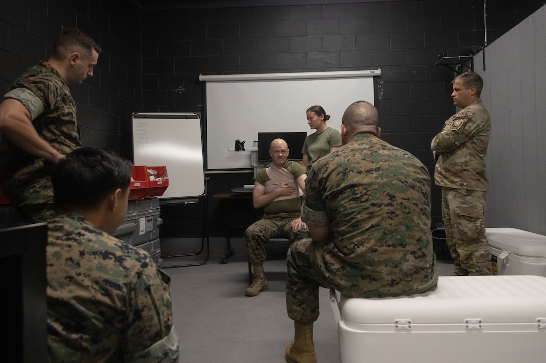U.S. Navy Sailors with 2nd Medical Battalion, 2nd Marine Logistic Group, and U.S. Coast Guard with Special Missions Training Center receive a class on Tier IV Tactical Combat Casualty Care at Battle Skills Training School, Marine Corps Base Camp Lejeune, North Carolina, July 15, 2025. Tier Four TCCC begins with refresher training and progresses to advanced levels of combat casualty care intended to train select military service members to be proficient combat paramedics. The course trains advanced level providers the combat paramedic skills necessary to treat patients at the point of injury on the battlefield and in austere environments. (U.S. Marine Corps photo by Lance Cpl. Brady V. Hathaway)