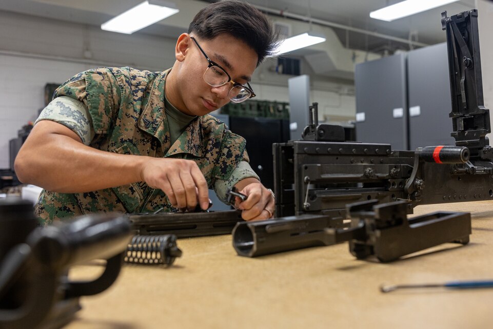 U.S. Marine Corps Cpl. Sean Catarroja, a small arms repairman with Headquarters and Service Battalion, 2nd Marine Logistics Group, and native of Jersey City, New Jersey, repairs a MK19 receiver assembly at Marine Corps Base Camp Lejeune, North Carolina, July 16, 2025. Catarroja’s command selected him as Warrior of the week for his exceptional leadership and dedication to mission readiness. Catarroja serves as the battalion's armory maintenance chief, inspecting, servicing, and guiding his team through monthly preventive maintenance checks of over 1,000 service rifles, which contributes to the battalion's 98% readiness. Each week, 2nd MLG recognizes one outstanding Marine or Sailor that goes above and beyond in their duties and embodies the qualities of an outstanding service member. (U.S. Marine Corps photo by Lance Cpl. Brady V. Hathaway)