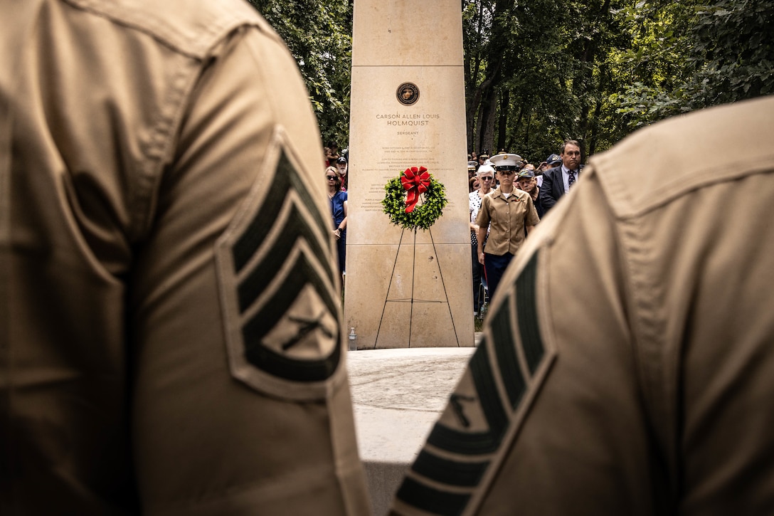 U.S. Marine Corps Sgt. Hailey Fowler, battery armory chief, with Battery M, 3rd battalion, 14th Marines, 4th Marine Division, Marine Forces Reserve, stands at the POA during the fallen five memorial ceremony at the Wreath of Honor Fallen Five Memorial Park, Chattanooga, Tennessee, July 16th, 2025. The Wreath of Honor Fallen Five Memorial honors the loss of five U.S. service members tragically killed July 16th, 2015, in a terrorist attack in Chattanooga. The placement of wreaths symbolizes gratitude, respect and remembrance for those who served and sacrificed for their country. (U.S. Marine Corps photo by Lance Cpl. Edward Spears)