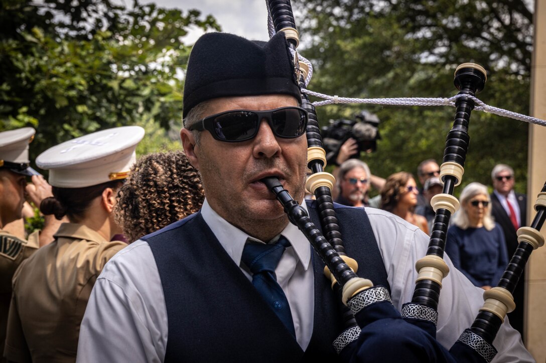 U.S. Navy Diron Cundiff, nurse corps, Navy Medicine Readiness and Training Command Bethesda, plays a bagpipe during the fallen five memorial ceremony at the Wreath of Honor Fallen Five Memorial Park, Chattanooga, Tennessee, July 16th, 2025. The Wreath of Honor Fallen Five Memorial honors the loss of five U.S. service members tragically killed July 16th, 2015, in a terrorist attack in Chattanooga, today, marking the 10-year anniversary and the vivid memory of their sacrifice. (U.S. Marine Corps photo by Lance Cpl. Edward Spears)