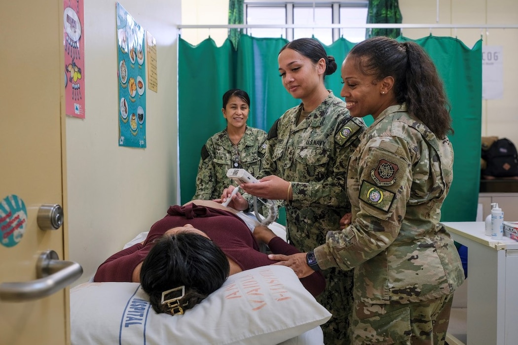 NUKU’ALOFA, Tonga (June 24, 2025) U.S. Army Maj. Tiffany Wilson, right, Nurse Practitioner deployed in support of Pacific Partnership 2025 (PP-25), U.S. Navy Hospital Corpsman Nicole Abreu, center, and U.S. Navy Cmdr. Cheryl Castro, Midwife with PP-25, deliver prenatal care to a local patient during a health consultation at Vaiola Hospital as part of PP-25 in Nuku’Alofa, Tonga, June 24, 2025. Now in its 21st iteration, the Pacific Partnership series is the largest annual multinational humanitarian assistance and disaster management preparedness mission conducted in the Indo-Pacific. Pacific Partnership works collaboratively with host and partner nations to enhance regional interoperability and disaster response capabilities, increase security and stability in the region, and foster new and enduring friendships in the Indo-Pacific. (U.S. Navy photo by Courtesy Asset/Released)
