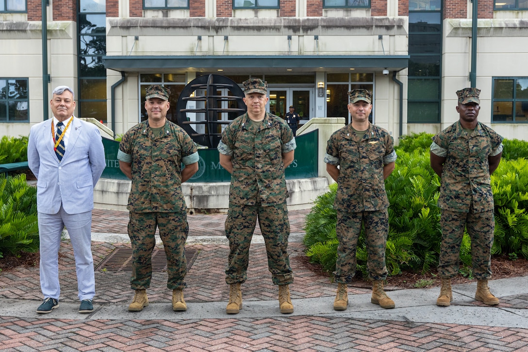 Marine Forces Reserve and Marine Forces South leaders stand at ease as they await the arrival of the 39th Commandant of the Marine Corps at Marine Corps Support Facility New Orleans, July 17, 2025. Gen. Eric Smith visited New Orleans to recognize the Marines and staff that dedicate their time and efforts to support the MARFORRES and MARFORSOUTH missions. (U.S. Marine Corps photo by Cpl. Aaron TorresLemus)