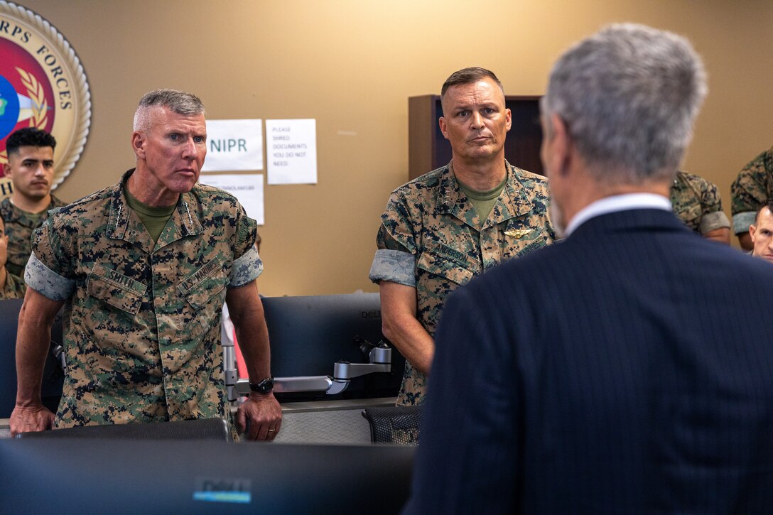 Mr. Tony Abati, G-5 assistant chief of staff, Marine Forces South briefs the 39th Commandant of the Marine Corps, Gen. Eric Smith (left) and Lt. Gen. Leonard Anderson (right), commander, Marine Forces Reserve and Marine Forces South, operations conducted with MARFORSOUTH at Marine Corps Support Facility New Orleans, July 17, 2025. Smith visited New Orleans to recognize the Marines and staff who dedicate their time and efforts to support the MARFORRES and MARFORSOUTH missions. (U.S. Marine Corps photo by Cpl. Aaron