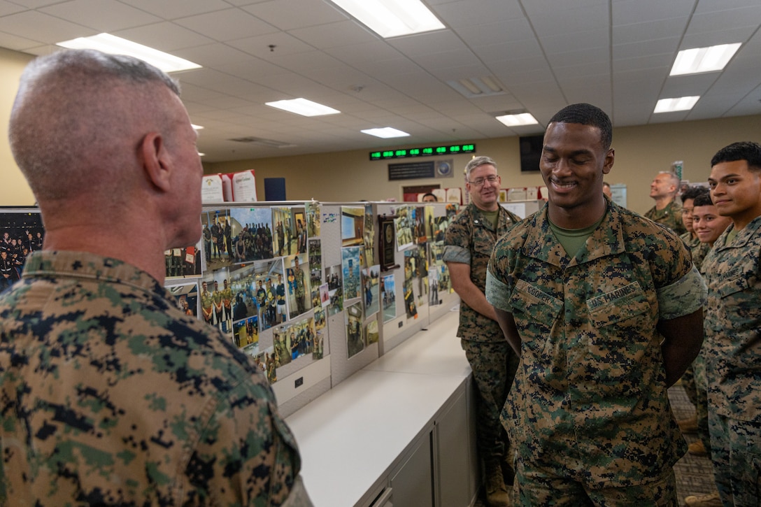 The 39th Commandant of the Marine Corps, Gen. Eric Smith, recognizes Cpl. Trakeci Cooper, a distribution specialist with Headquarters Battalion, Marine Forces Reserve, for his outstanding performance to the overall distribution management operations conducted at Marine Corps Support Facility New Orleans, July 17, 2025. Smith visited New Orleans to recognize the Marines and staff who dedicate their time and efforts to support the MARFORRES and MARFORSOUTH missions. (U.S. Marine Corps photo by Cpl. Aaron TorresLemus)