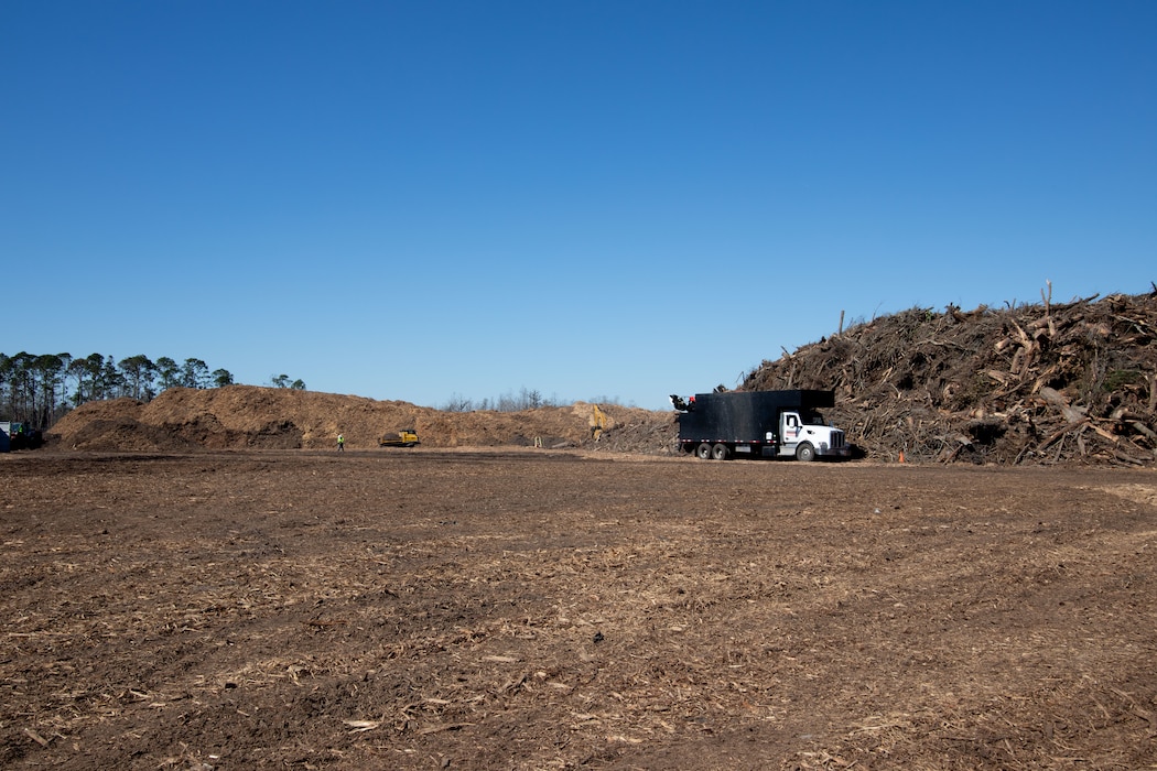 Debris from Hurricane Helene is brought from around Brooks County to the Langsdale TDSR for storage and reduction. The debris is measured as it arrives and measured once again as it leaves after being mulched. USACE Quality Assurance Inspectors work alongside the contractors to notate volume of debris as it enters and exits the TDSR. (U.S. Army photo by Makenzie Leonard)