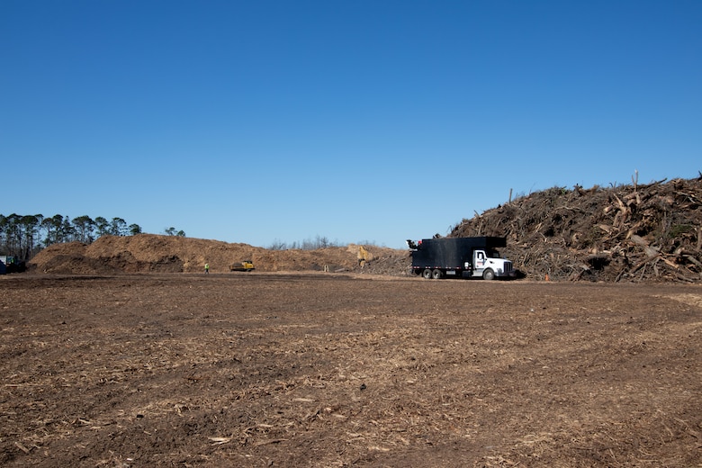 Debris from Hurricane Helene is brought from around Brooks County to the Langsdale TDSR for storage and reduction. The debris is measured as it arrives and measured once again as it leaves after being mulched. USACE Quality Assurance Inspectors work alongside the contractors to notate volume of debris as it enters and exits the TDSR. (U.S. Army photo by Makenzie Leonard)