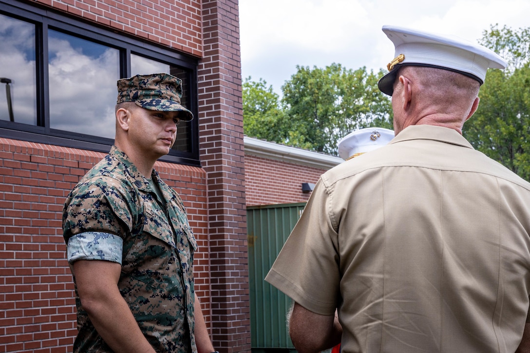 U.S. Marine Corps Brig. Gen. John Jarrard, right, commanding general, 4th Marine Division, Marine Forces Reserve, speaks to Gunnery Sgt. Benjamin Gutierrez, left, Battery Gunnery Sgt, 3rd battalion, 14th Marines, 4th Marine Division, Marine Forces Reserve, at Navy Reserve Center Chattanooga, Chattanooga, Tennessee, July 16th, 2025. The NRC was the command of the fallen five who lost their life’s July 16th, 2015, in a terrorist attack in Chattanooga, today, marking the 10-year anniversary and the vivid memory of their sacrifice.