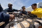 PUERTO PLATA, Dominican Republic (July 15, 2025) Sailors assigned to the Mercy-class hospital ship USNS Comfort (T-AH 20) load medical site cargo aboard Comfort in Puerto Plata, Dominican Republic during Continuing Promise 2025, July 15, 2025. Continuing Promise 2025 is the 16th iteration of the U.S. 4th Fleet/U.S. Naval Forces Southern Command-led Mission since 2007, which aims to foster goodwill, strengthen existing partnerships with partner nations, and form new partnerships between host nations, non-federal entities, and international organizations. (U.S. Navy photo by Mass Communication Specialist 2nd Class Alfredo Marron)