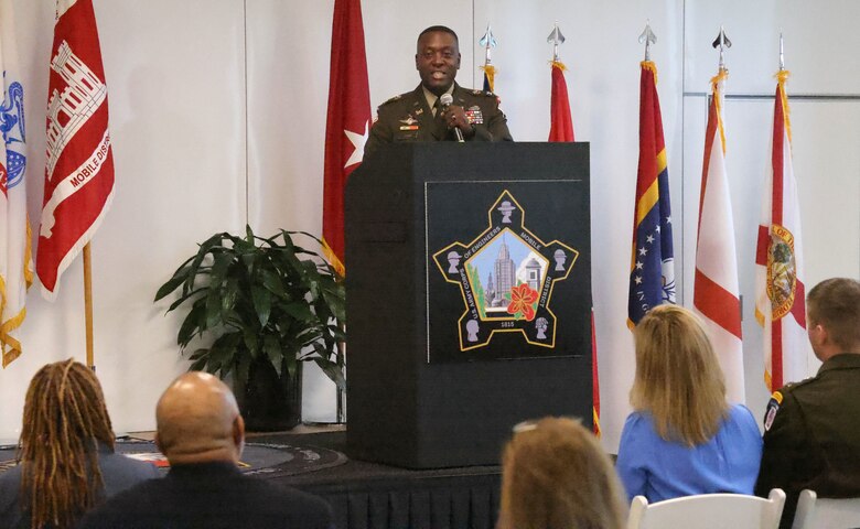 Man speaking at podium.