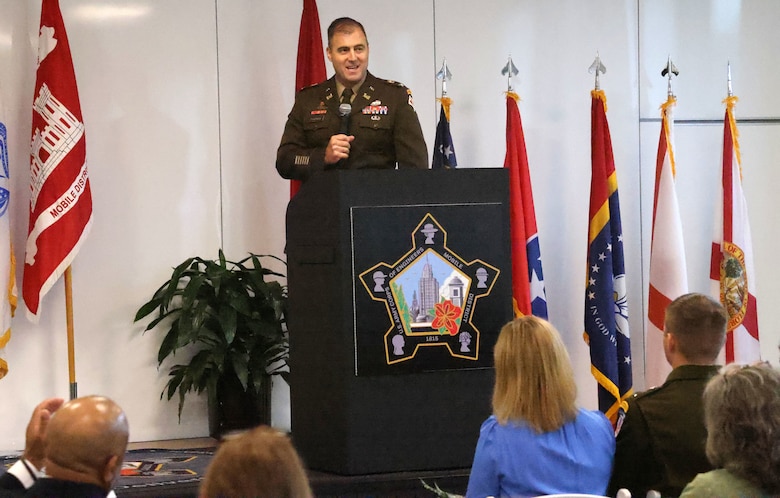 Man speaking at podium.