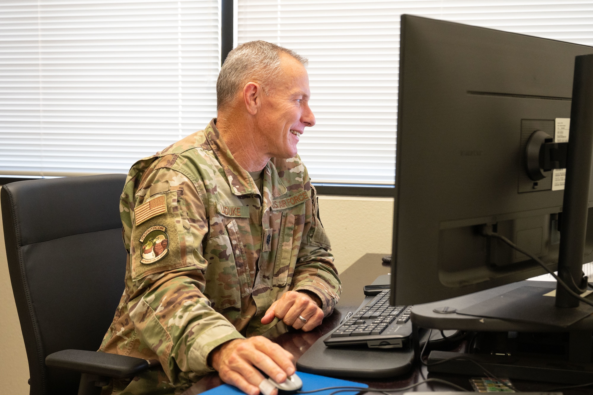 U.S. Air Force Lt. Col. Wiliam LaDuke, 355th Wing Office of the Staff Judge Advocate assistant staff judge advocate, works on his computer at Davis-Monthan Air Force Base, Arizona, July 18, 2025. As assistant staff judge advocate, LaDuke provides legal assistance directly to the commander and senior staff. (U.S. Air Force photo by Airman Jaden Kidd)