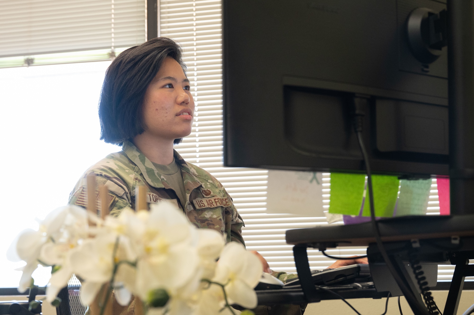 U.S. Air Force 1st Lt. Elle Topacio, 355th Wing Office of the Staff Judge Advocate chief of discharges, checks her email at Davis-Monthan Air Force Base, Arizona, July 18, 2025. The OSJA focused on many types of law such as military justice, administrative actions, ethics, operations law, environmental law, claims, contracts, civil law and labor law. (U.S. Air Force photo by Airman Jaden Kidd)