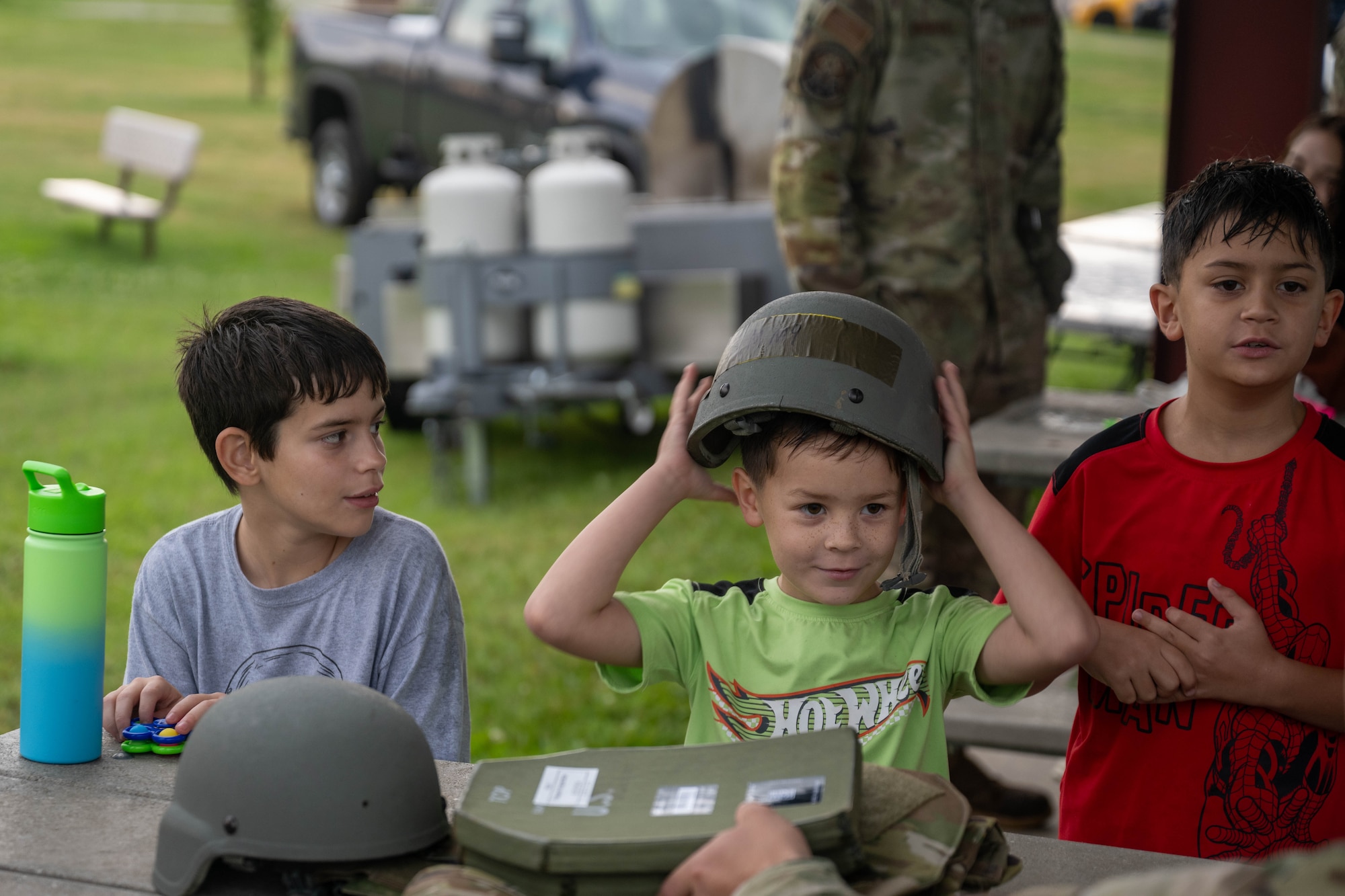 Families learn how to assemble a plate carrier.
